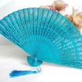 Elegant turquoise hollowed-out wooden folding fan featuring a matching blue tassel - Army Green