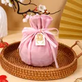 Elegant pink velvet drawstring gift bag for wedding favors with silk ribbon and gold tag - With Double Happiness And Tag / Pink
