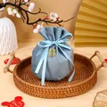 Elegant dusty blue velvet drawstring bag for wedding favors with gold charm - With Double Happiness Pendant / Blue