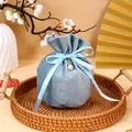 Elegant light blue velvet drawstring favor bag with ribbon bow and pearl charm - With Pearl Decoration / Blue