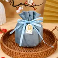 Blue velvet wedding gift pouch with drawstring and golden double happiness tag. - With Double Happiness And Tag / Blue
