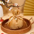 Velvet drawstring wedding favor bag in gold with Double Happiness pearl charm - With Double Happiness Pendant And Pearl / Champagne