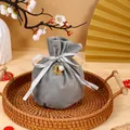 Elegant grey velvet wedding drawstring candy bag with pearl and golden Double Happiness charm - With Double Happiness Pendant And Pearl / Gray