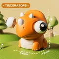 Simpatico dinosauro triceratops arancione con occhi popping per alleviare stress - Triceratops Occhi Pop Squishy