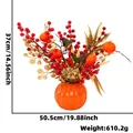 Festliches künstliches Blumengesteck mit roten Beeren und Kakis in oranger Kürbisvase - Festliches Ornament ZH-C