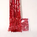 Detail of vibrant red metallic tinsel fringe curtain with retail packaging included - 1*2M / Red