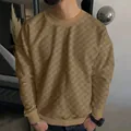 Detail showing the heavy jacquard checkerboard texture of this men's khaki knit sweater. - S / Tops / Khaki
