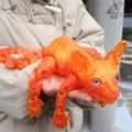 Giant articulated 3D printed orange Sphynx cat figurine with movable joints and realistic eyes - 50cm / Red Crystal