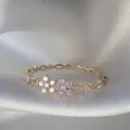 Anello dorato regolabile con delicato design floreale in zircone rosa e bianco - Aperto Regolabile / Fiore Zirconia Tondo Rosa Bianco (JZ010)