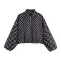 Detailed view of vintage black and white polka dot cropped jacket with front zip closure - S / Tops / Black White Polka Dot