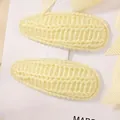 Pair of cute yellow knitted teardrop BB hair clips for girls on white display card - Yellow