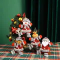 Cute plush Christmas doll ornaments set featuring Santa, Snowman, and Reindeer figures. - New Style Dancing Pendant Set (4 Pieces)