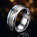 Men's titanium steel ring featuring gold dragon pattern and blue inlay detail SKU - Blue Base Gold Celtic Dragon