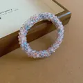 Macro view of faceted pink and blue beads on a delicate French-style woven bracelet. - 72# Bracelet / Pink-Gray
