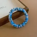 Detail shot of a French-style beaded bracelet with blue and white faceted crystal beads - 73# Bracelet / Blue-Grey