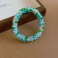 Close-up of French-style colorful beaded bracelet with intricate woven texture - 74# Bracelet / White-Green