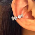 Close-up showing the elegant silver zircon ear cuff worn on the model's ear cartilage - Silver (9469)