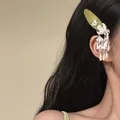 Detailed close-up view of a Chinese style floral hair clip with silver tassels - Bell Tassel Snap Clip / Single Piece / Silver and Green