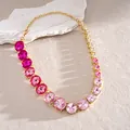 Close-up of a gradient pink crystal necklace with faceted rhinestones in gold setting - Choker Necklace / Necklace-Rose Red-Pink