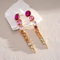Detailed view of long gradient crystal dangle earrings with magenta and amber stones - Earring Post-Gold-Rose Red-Pink