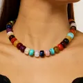 Close-up of a colorful dopamine style beaded rainbow necklace on a woman's neck. - Rainbow Dopamine Style / Colorful