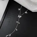 Detail view of French style Y-shaped necklace with starry white pearls and silver chain - Silver White