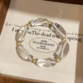 Elegante pulsera coreana de resina transparente con detalles de cristal dorado - Pulsera (HB6247) / Rosa