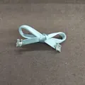Light blue fabric ribbon bow hair clip featuring clear star accents on a grey background - Duckbill Hair Clips / Blue