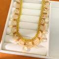 Detailed macro view of vintage palace style beaded lace necklace featuring amber glass drop pendants - Coffee (10#)