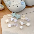 Detail of summer beach style shoe charms with pearl, shell, and star designs for DIY - Set of 18 / White-Blue