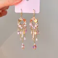 Close-up of Bohemian zircon and crystal tassel earrings with gold-plated ear hooks - 45# Ear Hook - Gold - Pink
