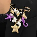Detail view of ocean-themed brooch with starfish and seahorse on a black blazer. - Starfish Seahorse Tassel Style (11866) / Purple