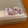 Elegantes pendientes de plata con circonitas rosas y blancas en diseño floral. - Solo Pendientes / Rosa Plateado