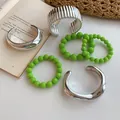 Detailed view of a 6-piece silver geometric bangle and green beaded bracelet set - 6-Piece Set / 64# Bangle Silver Green
