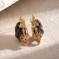 Close-up of irregular geometric gold earrings with textured surface and rhinestones - Stud Pin Style / Gold-Gray (HE34428)
