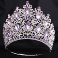 Detailed view of a luxurious silver bridal tiara with sparkling purple crystals. - Silver (White and Purple Stone + Adjustable)