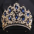 Close-up of luxury bridal tiara with navy blue crystals and leaf-shaped gold metalwork - KC Gold (White and Dark Blue Rhinestone)