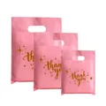 Set of pink plastic gift shopping bags with elegant gold 'thank you' script print - 35*45cm / Pink Star with Gold Text