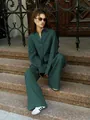 Detailed view of dark green loose linen long sleeve shirt and wide leg trousers casual set - S / Top And Bottom / Dark Green