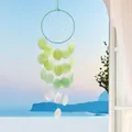 Handmade shell dreamcatcher wind chime with green and white shells hanging by sea view - Finished Product / Full Moon Shell - Lemon