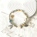 Vintage style Jingdezhen ceramic beaded bracelet with butterfly and ginkgo leaf charms. - Young Noble (1002-01) / Off White