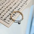 Elegant Jingdezhen ceramic beaded bracelet featuring a traditional silver lock charm pendant - Safety Lock (1006-01) / Beige