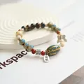 Vintage Jingdezhen ceramic beaded bracelet with a silver butterfly and 'Rich' charm - Wealth Soon (1009-01) / Dark Blue