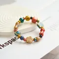 Colorful handmade Jingdezhen ceramic beaded bracelet featuring flower and peanut charms - Flowers at Sea (1009-02) / Multicolor