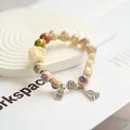 Handmade ancient style ceramic beaded bracelet with carved flower and silver tassel - Splendid Lion (1009-04) / Purple