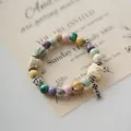 Handmade ceramic beaded bracelet with vintage charm and pastel porcelain beads. - Auspicious Lion (1009-06) / Multicolor