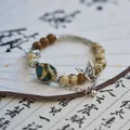 Vintage Jingdezhen ceramic beaded bracelet with silver butterfly charm and tassel detail - Butterfly Dance (1011-03) / Turquoise Green