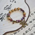 Vintage Jingdezhen ceramic beaded bracelet with butterfly charm on white fan background - Yichuange (1022-01) / Fuschia
