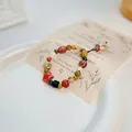 Vintage style handmade colorful ceramic beaded bracelet with star and butterfly charms - Lanji (1033-04) / Multicolor