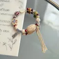 Handmade ceramic beaded bracelet with vintage tassel and an engraved lucky charm - 1039-04 Zhuruoshui Style